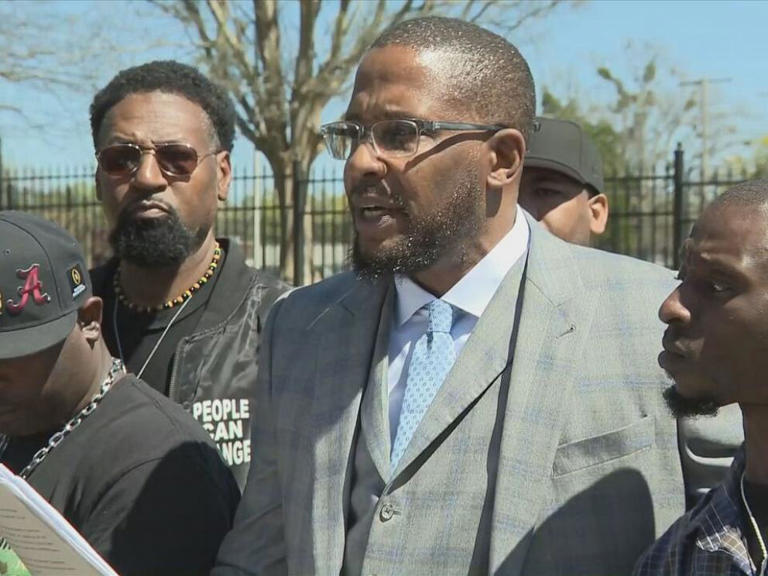 Eddie Parker, left, and Michael Jenkins, right, speak out with their attorney Malik Shabazz during a press conference on March 18, 2024 in Jackson, Miss.