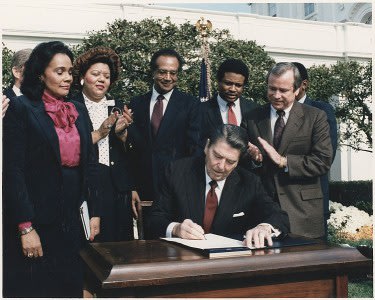751px-Photograph_of_President_Reagan_and_the_Signing_Ceremony_for_Martin_Luther_King_Holiday_Legislation.jpg