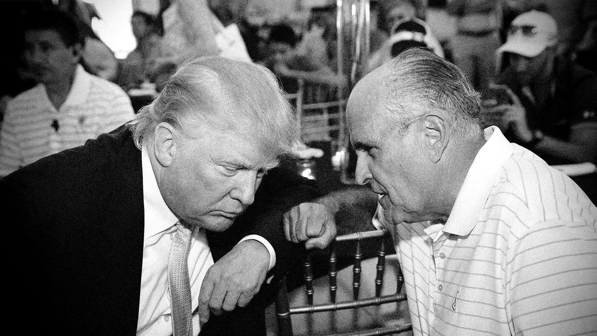 Thenpresidential candidate Donald Trump speaks to Rudy Giuliani at a fundraising event in the Bronx July 6 2015.