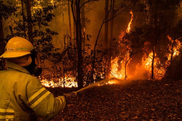 Fighting a fire in Tomerong, New South Wales, Australia, on Saturday.